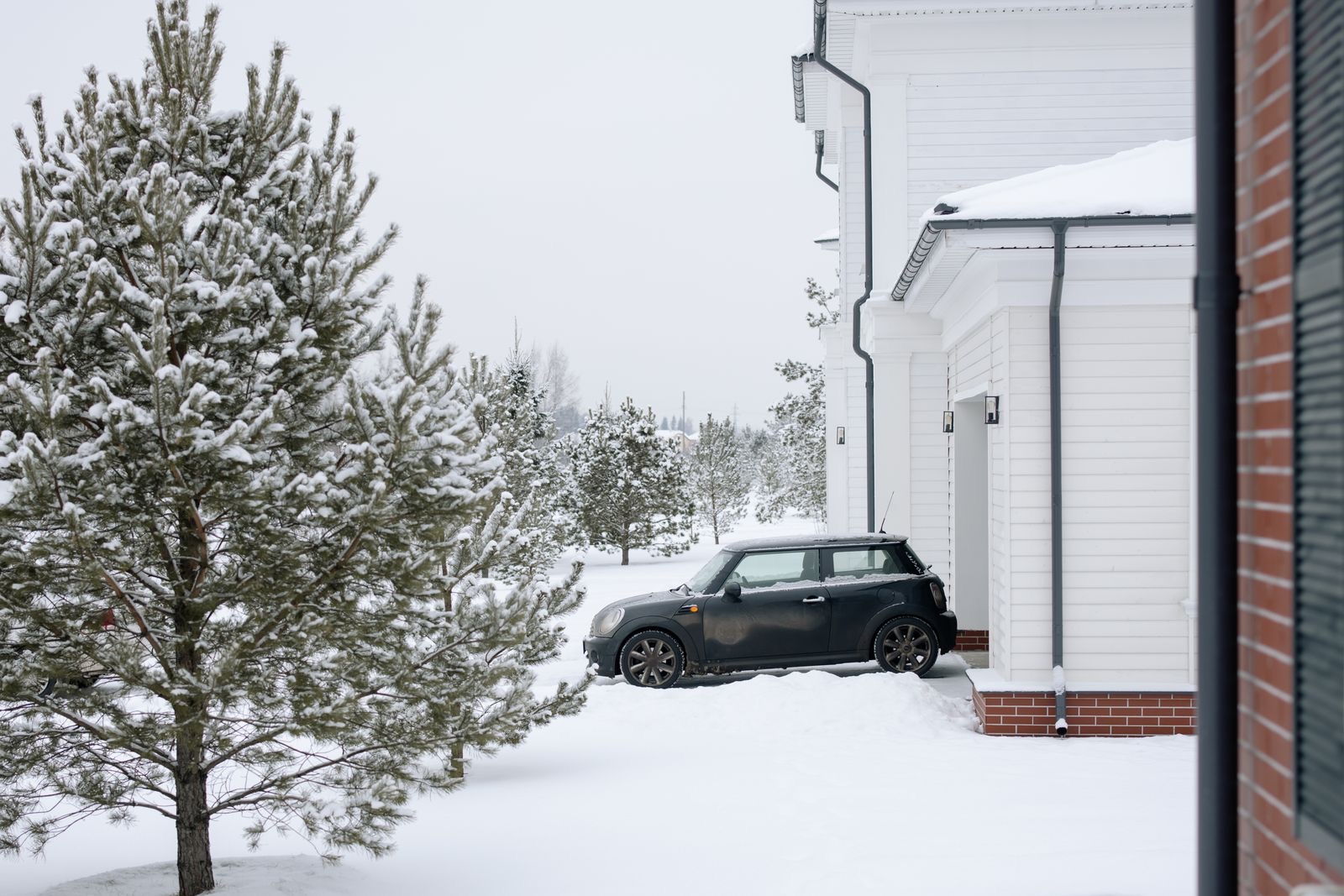 Fresh overnight snow on a quiet residential street — the mornings winter service is built for