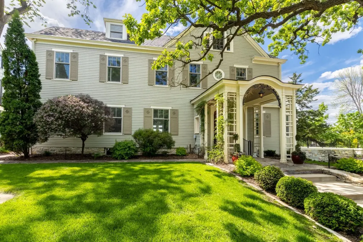 A designed front landscape at a stately Twin Cities home
