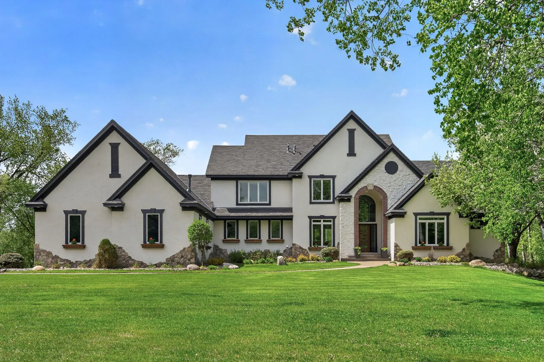 A stately home and manicured lawn in the southwest Twin Cities metro