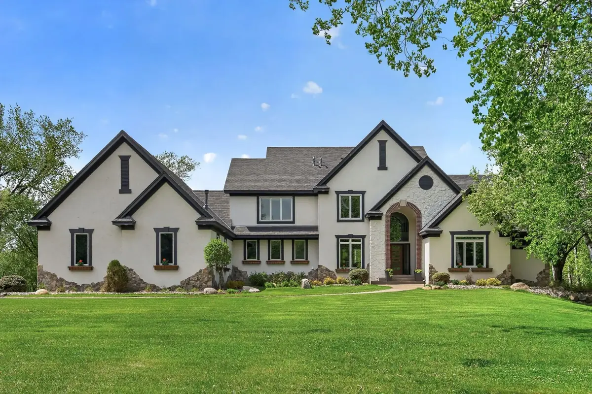 A stately home and manicured lawn in the southwest Twin Cities metro