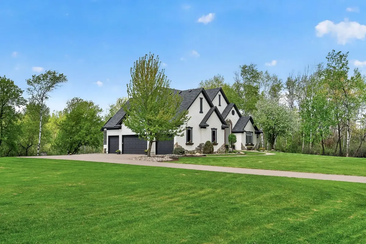 A large home with a broad, well-kept lawn in the southwest Twin Cities metro