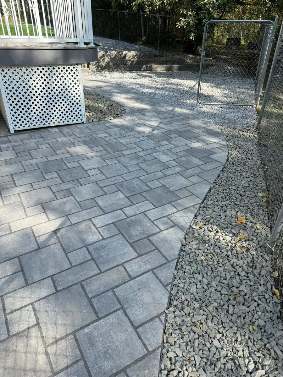 A paver walkway and stone border installed by Heads Up in the southwest Twin Cities metro