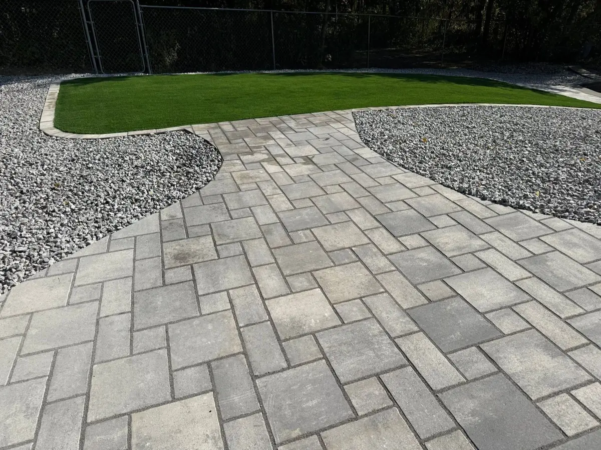 A backyard paver patio and fire pit finished by the install crew