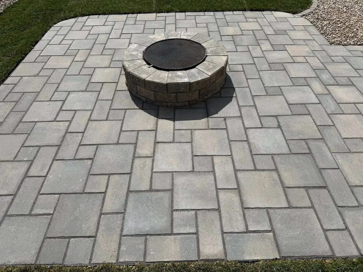 A paver patio and stone fire pit we built