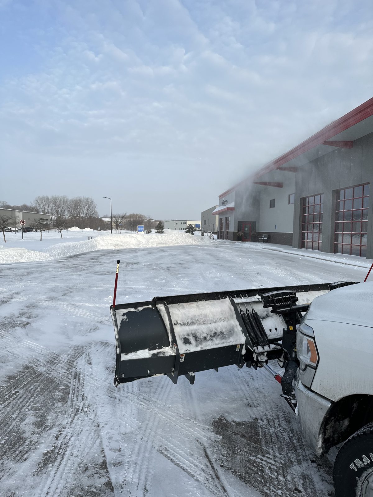 Heads Up plow truck clearing a snowy commercial lot in Shakopee, MN