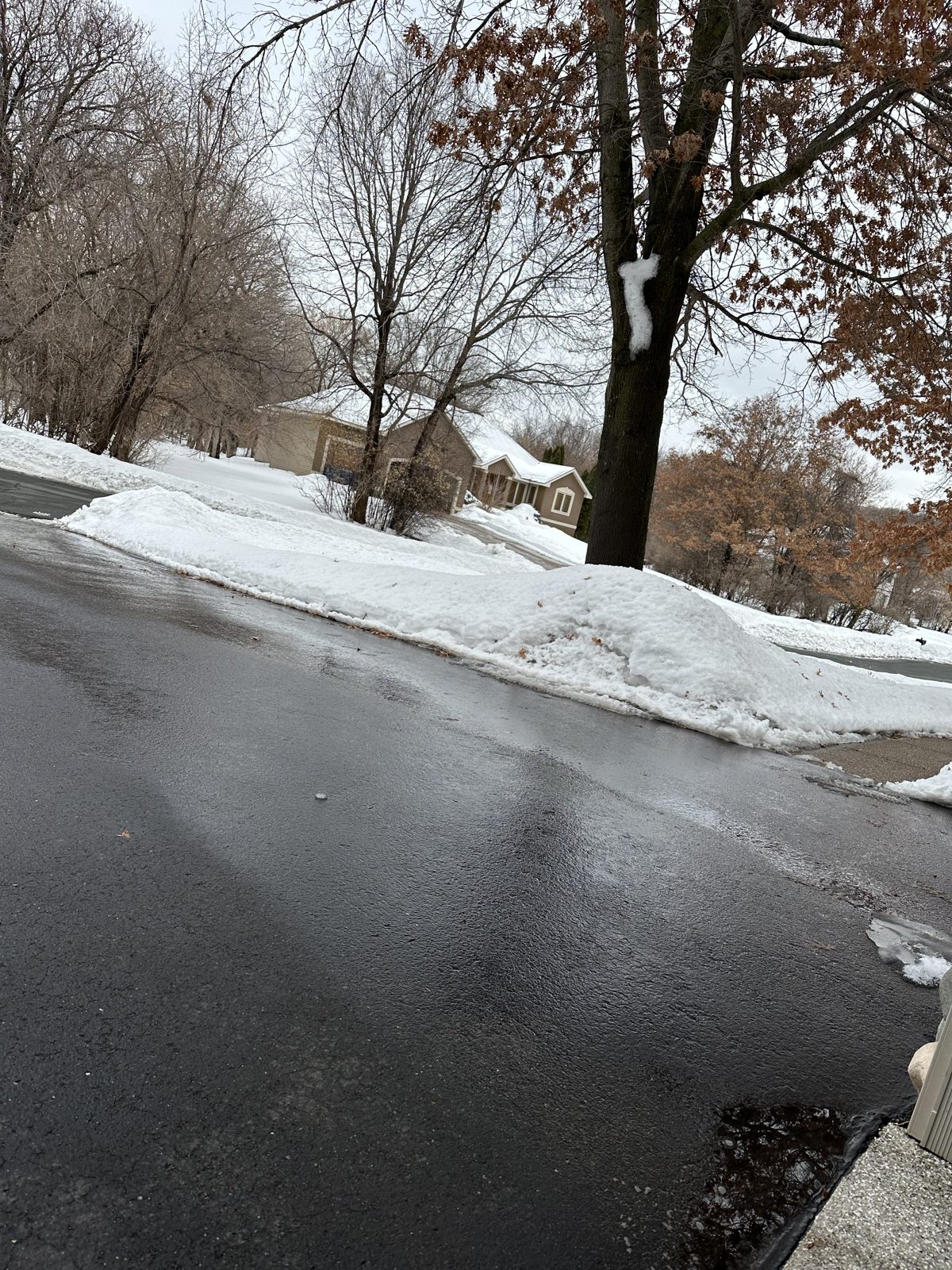 Driveway cleared to the pavement after a snowstorm in Chaska, MN