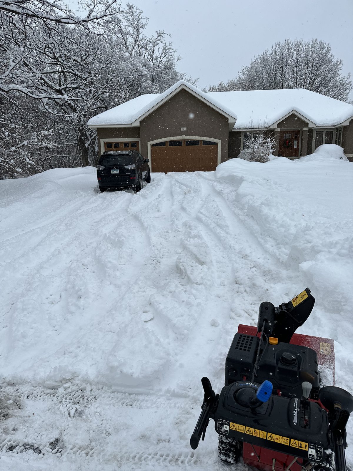 Snowblower clearing deep snow from a Jordan, MN driveway